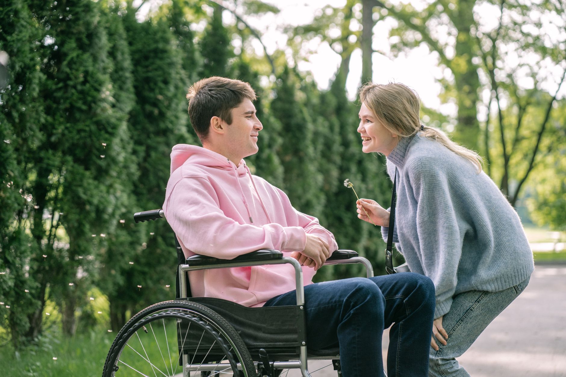 A support worker and a participant enjoying a cheerful moment together